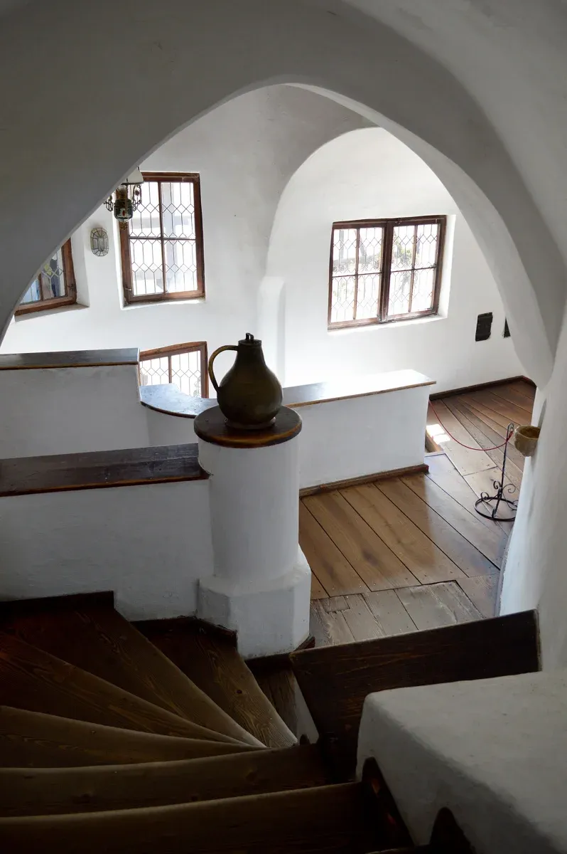 A staircase and corridor inside Bran Castle on a private Dracula Castle tour from Bucharest