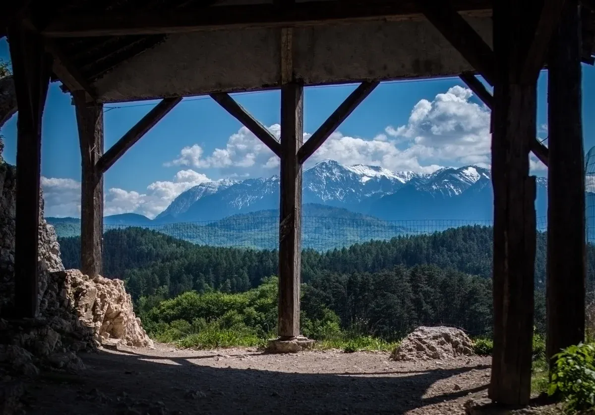 The view from Rasnov Citadel toward the Bucegi mountains, a stop on Dracula Castle tours from Brasov